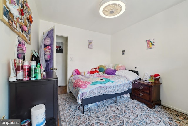 bedroom featuring baseboards