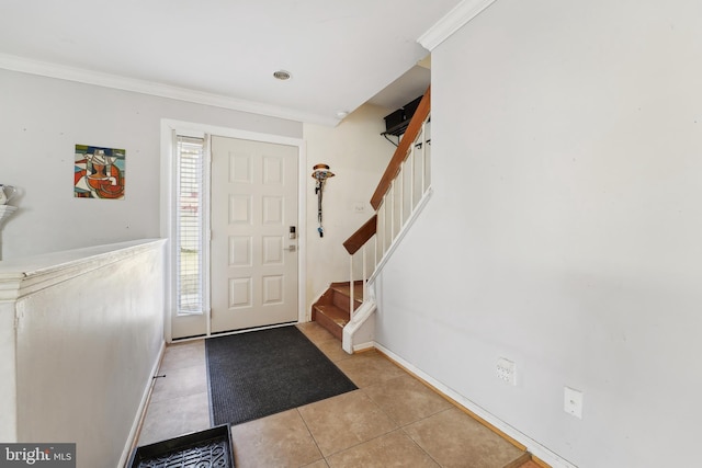 entryway with ornamental molding, stairway, baseboards, and light tile patterned floors