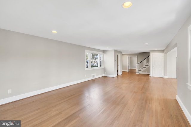 unfurnished living room featuring light hardwood / wood-style flooring