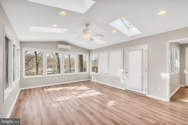 unfurnished sunroom with ceiling fan, a wall mounted air conditioner, and vaulted ceiling