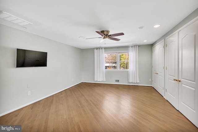 interior space with ceiling fan and light wood-type flooring