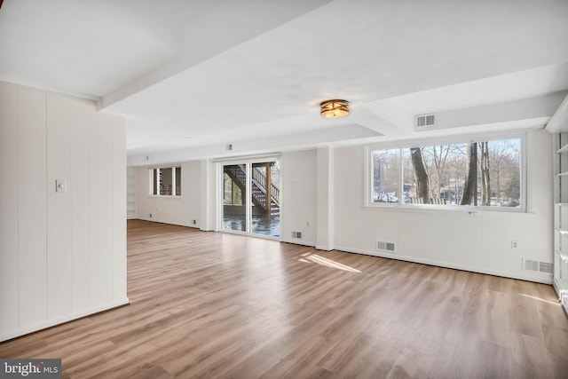 unfurnished living room featuring light wood-type flooring