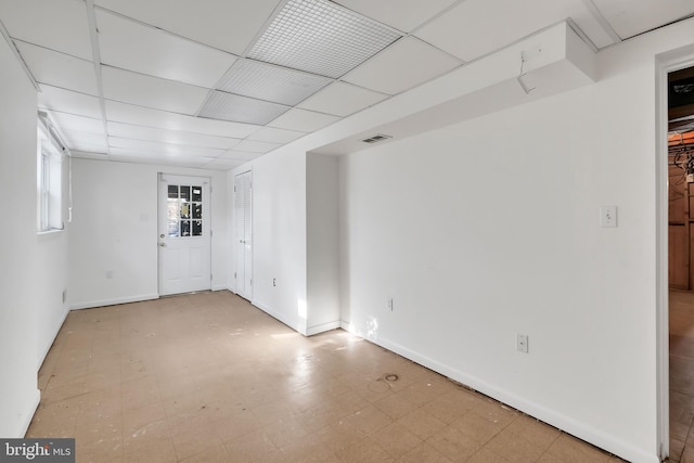 basement featuring a drop ceiling