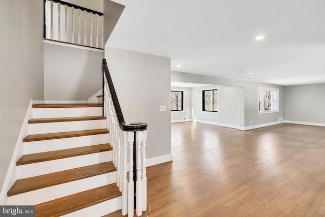 stairway featuring wood-type flooring