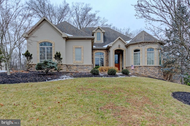 french provincial home with a front lawn