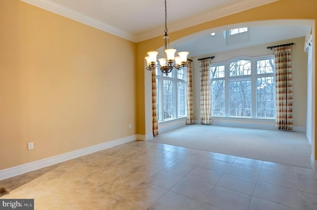 unfurnished dining area featuring an inviting chandelier, crown molding, and carpet flooring