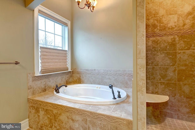 bathroom with a relaxing tiled tub