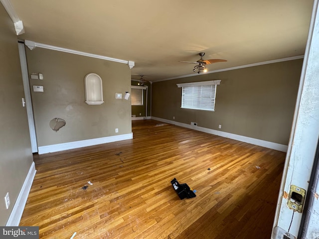 unfurnished living room with ornamental molding, ceiling fan, and light hardwood / wood-style flooring