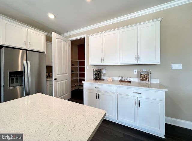 8022 Coastal Villages Blvd, Selbyville, DE 19975 - kitchen featuring dark hardwood / wood-style flooring, white cabinets, light stone counters, and stainless steel fridge with ice dispenser