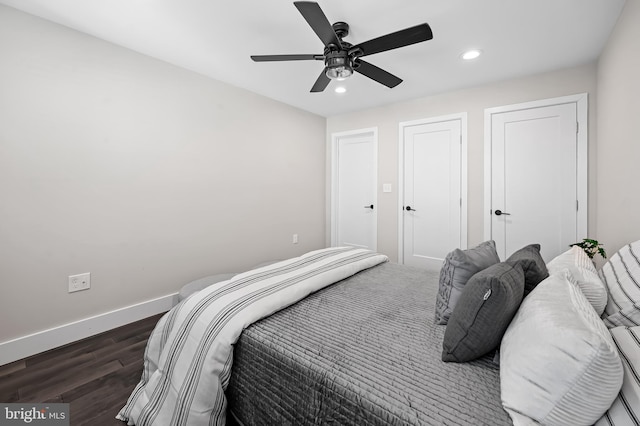 bedroom featuring dark wood-type flooring, recessed lighting, ceiling fan, and baseboards