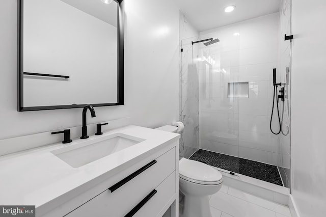 full bath with toilet, a stall shower, recessed lighting, and vanity