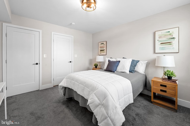 carpeted bedroom with baseboards