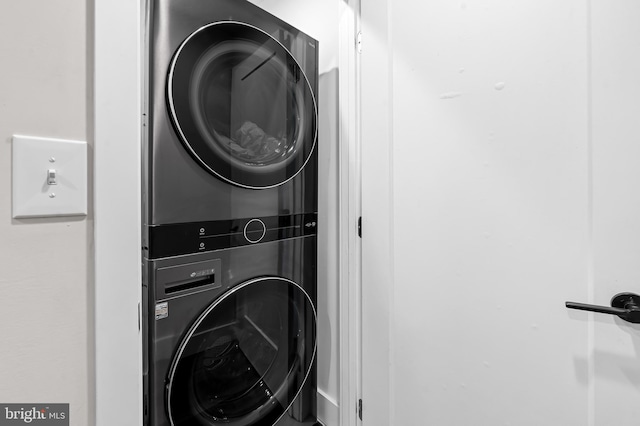 laundry area with stacked washing maching and dryer and laundry area