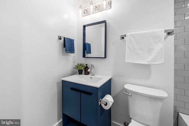 bathroom featuring vanity and toilet