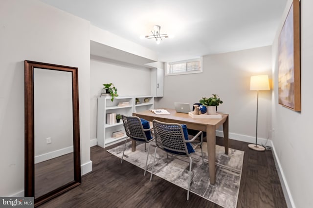 office space with baseboards and wood finished floors