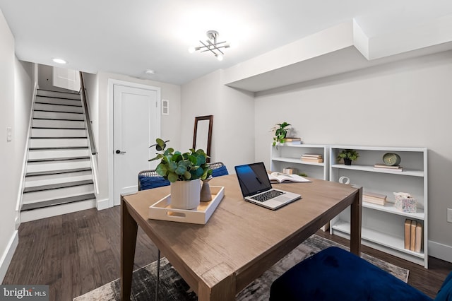 office area with dark wood finished floors and baseboards