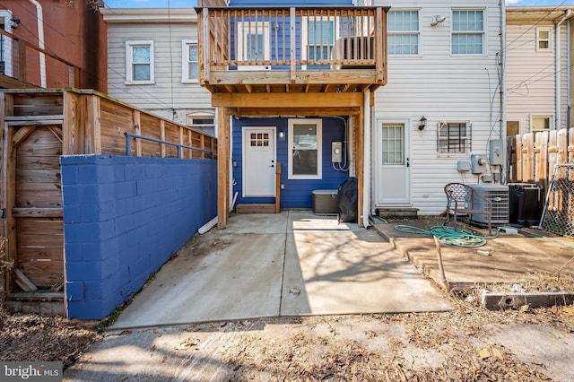 back of property with a patio, fence, a balcony, and central air condition unit