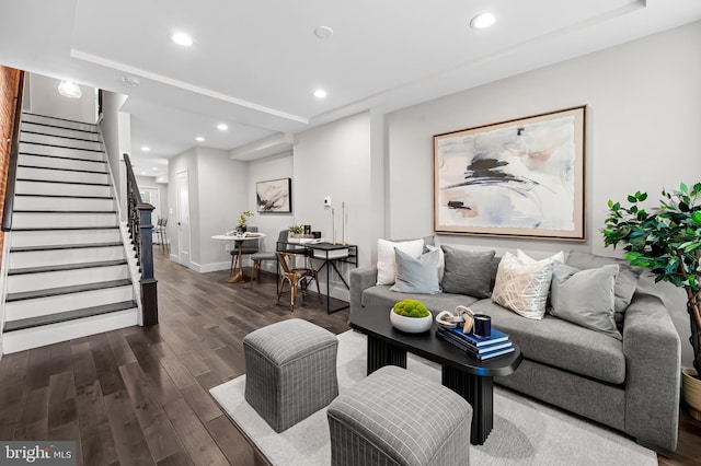 living room with dark wood-type flooring, recessed lighting, stairway, and baseboards