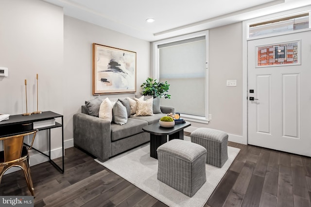 living room with recessed lighting, dark wood finished floors, and baseboards