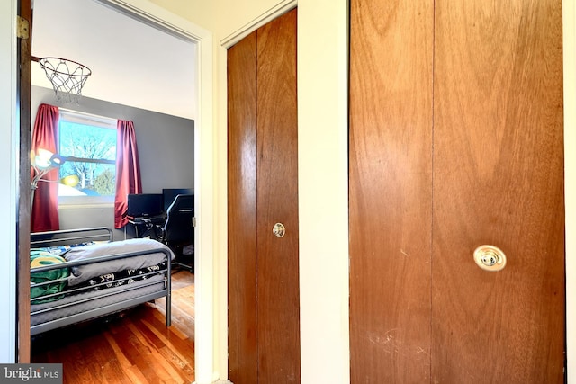 bedroom with wood finished floors