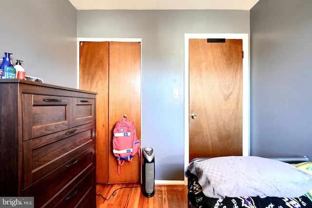 bedroom with a closet and light wood-style floors