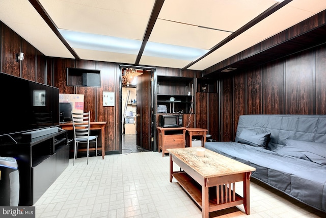 living room featuring wood walls