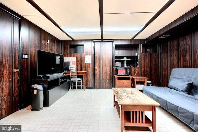 living room featuring wood walls