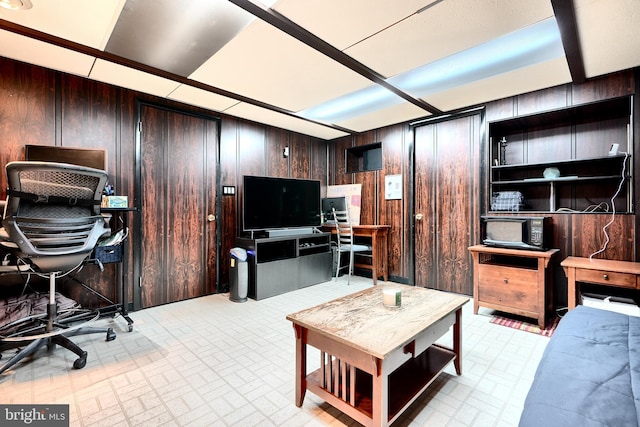 office space featuring wood walls