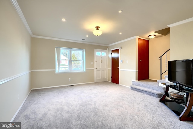 unfurnished living room with baseboards, light carpet, stairway, and crown molding