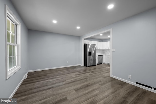 unfurnished living room featuring hardwood / wood-style floors