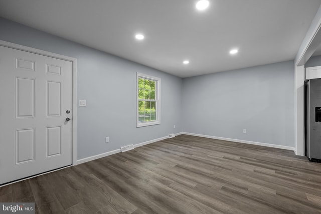 unfurnished living room with light wood-type flooring