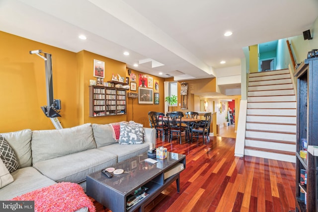 living area with stairway, wood finished floors, and recessed lighting