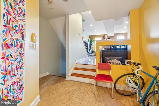 interior space featuring recessed lighting, baseboards, and tile patterned floors