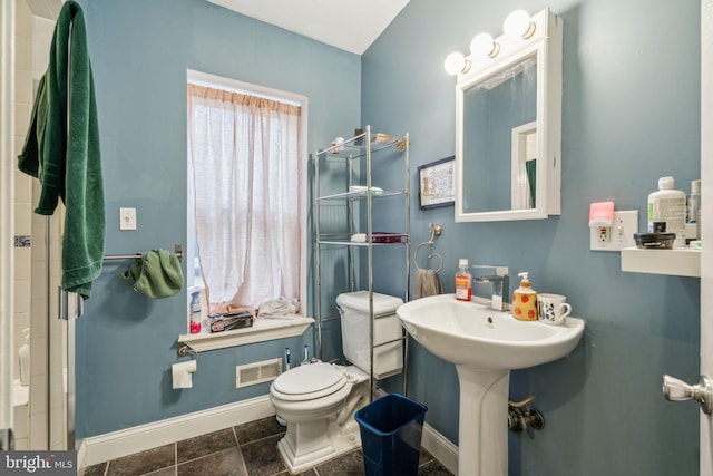 bathroom featuring toilet, visible vents, and baseboards