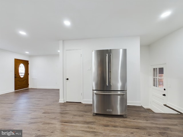 kitchen featuring dark wood-type flooring and high end refrigerator