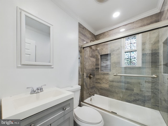 full bathroom featuring crown molding, vanity, toilet, and combined bath / shower with glass door