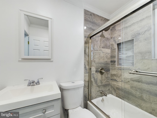 full bathroom featuring vanity, ornamental molding, enclosed tub / shower combo, and toilet