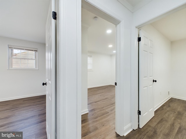 hallway with dark hardwood / wood-style flooring