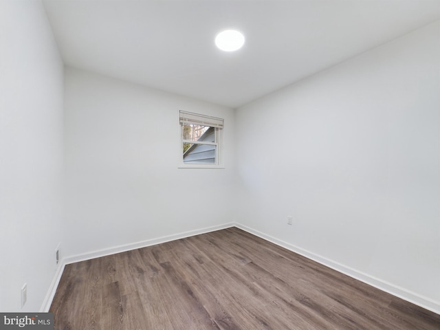 unfurnished room featuring hardwood / wood-style flooring