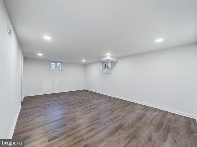 basement featuring dark hardwood / wood-style floors