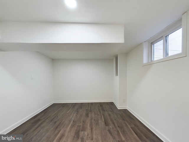 basement with dark wood-type flooring