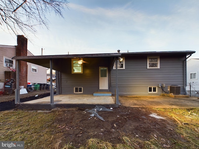 back of property featuring cooling unit and a patio area