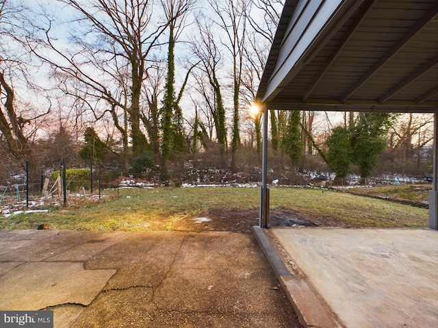 yard at dusk with a patio