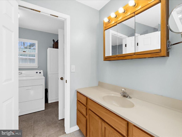 bathroom with washer / dryer and vanity