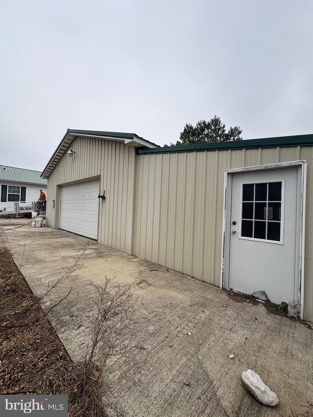 garage with concrete driveway