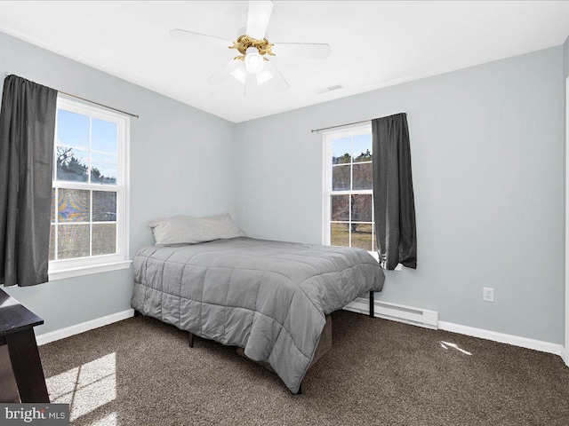 bedroom with ceiling fan, a baseboard radiator, carpet flooring, visible vents, and baseboards