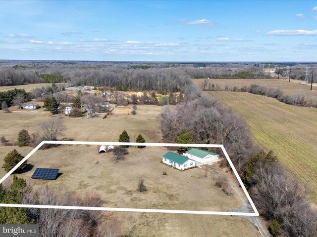 birds eye view of property with a rural view