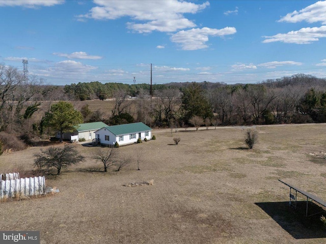 exterior space with a rural view