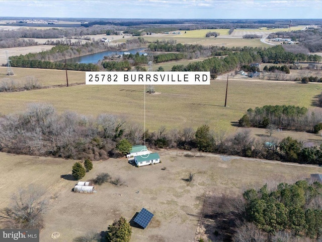 drone / aerial view with a water view and a rural view