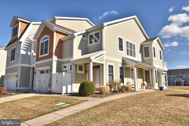 view of front of home featuring a garage and a front yard